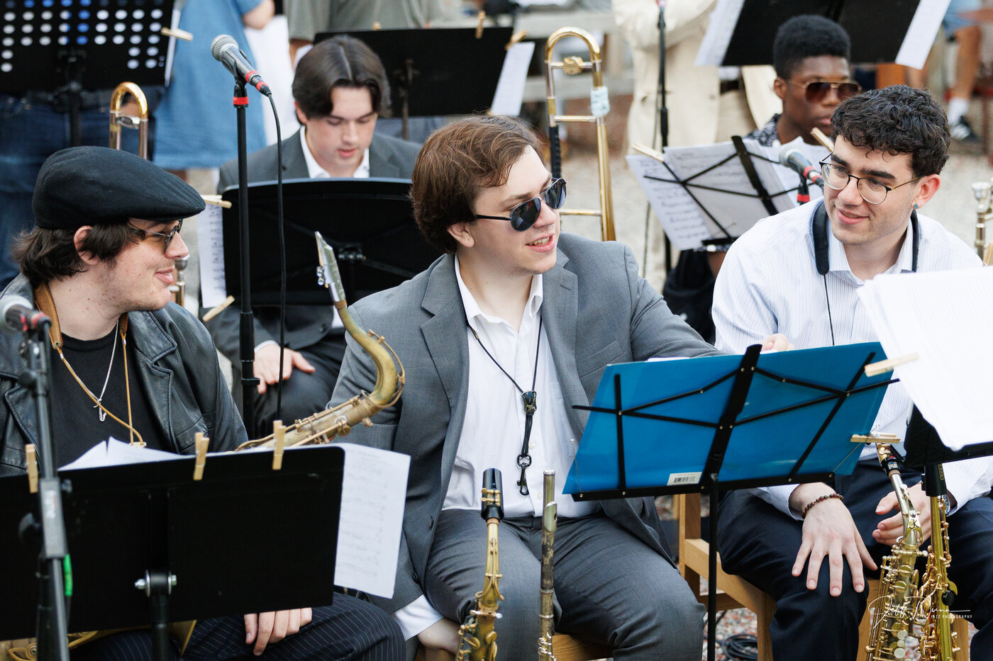 Andrew Wittmer talking with fellow saxophonists between numbers at a Gathering Orchestra performance