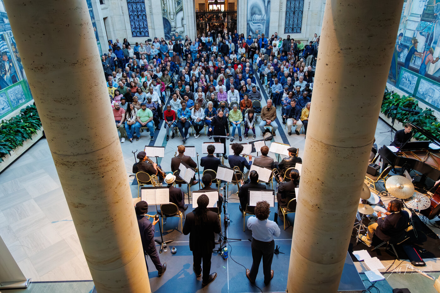 View from the bandstand: Gathering Orchestra performing for a full audience in the Rivera Court